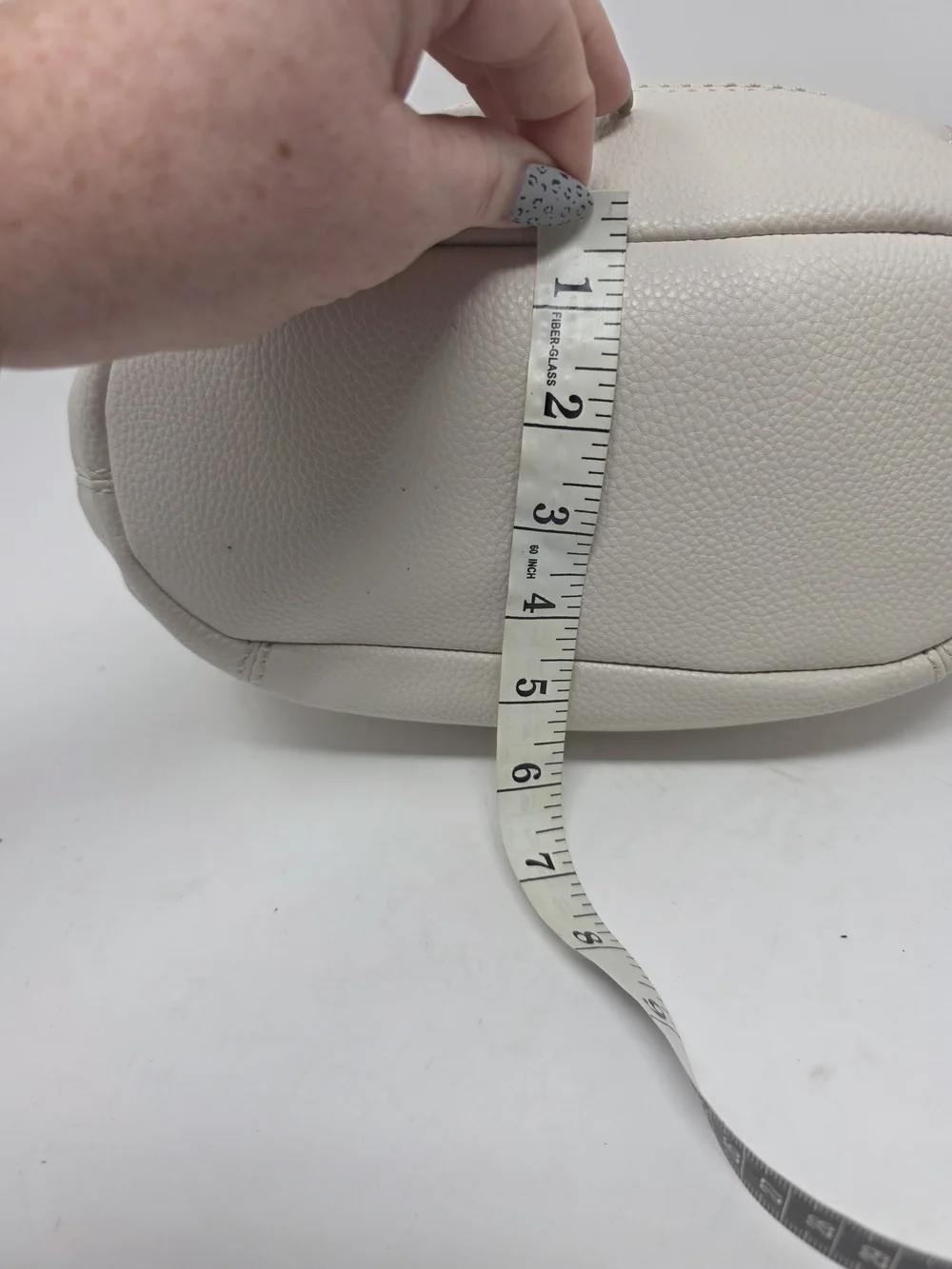 ​The Sak Off White Pebbled Leather Hobo Bag Perforated Cutout Tassel